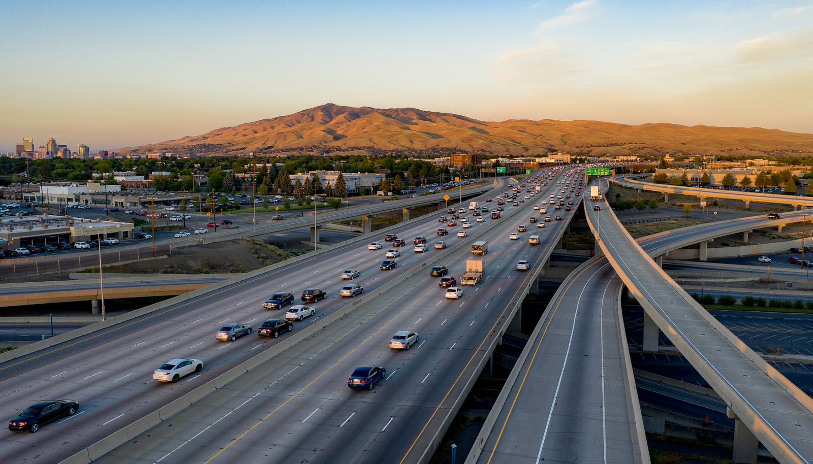 Interstate 84 traffic between Boise and Meridian with the Boise foothills in the distance.